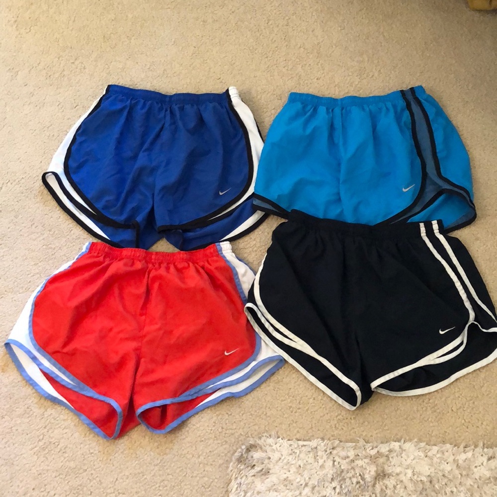4 pair of medium Nike Running shorts